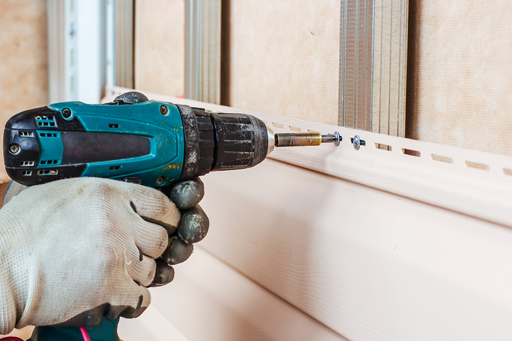 Drill being used to make repairs after home inspection services were preformed