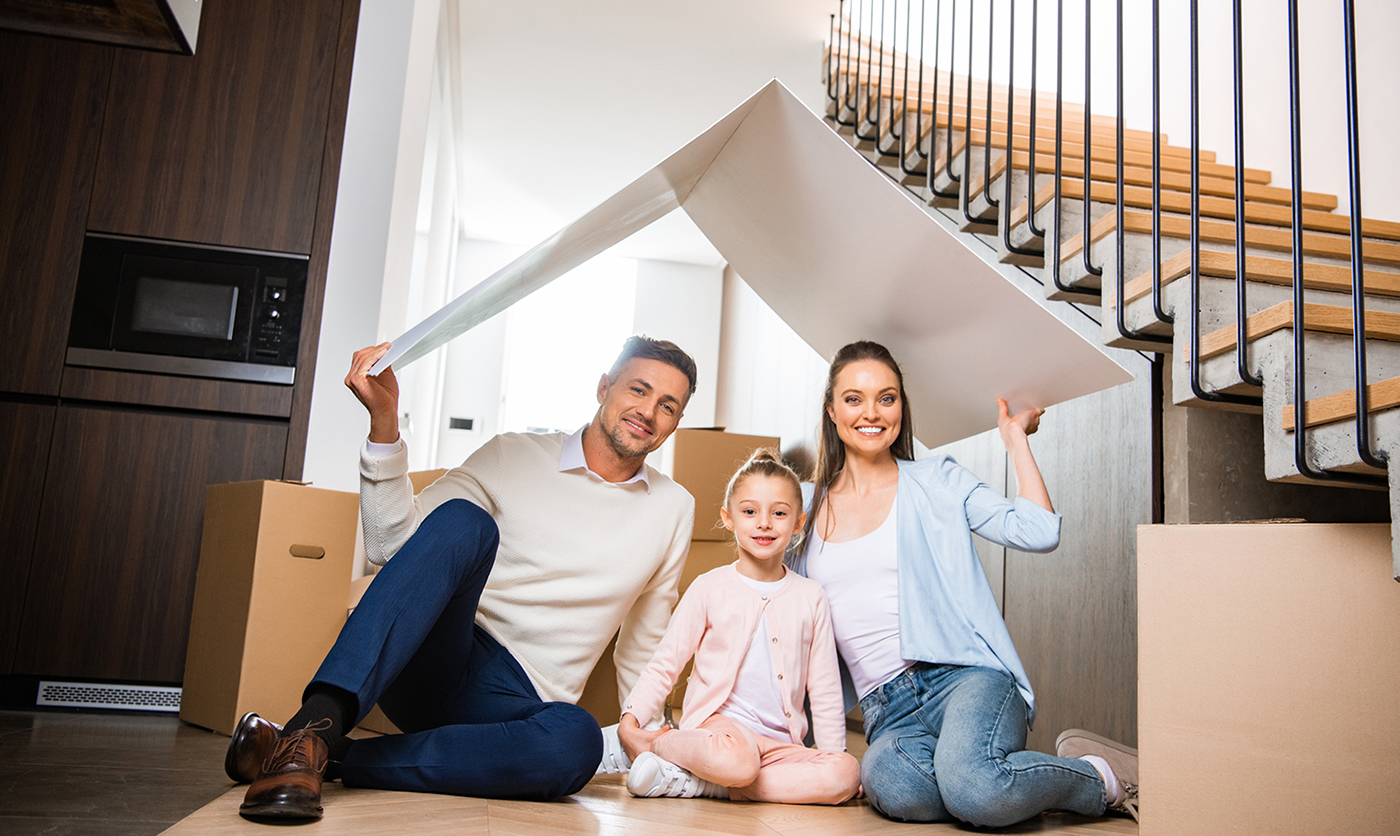 Happy family in their new house after a home inspection 